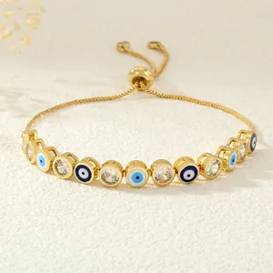 Adjustable golden evil eye bracelet with colorful enamel charms and cubic zirconia