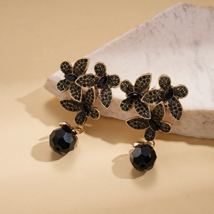 Vintage bronze flower earrings with black rhinestones and faceted crystal drops