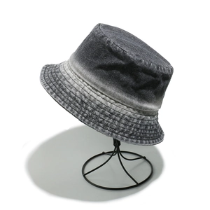 Close-up of gradient denim bucket hat showing detailed stitching and washed texture