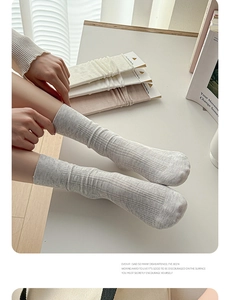 Detail of breathable hollow knit texture and ribbed cuffs on cotton crew socks