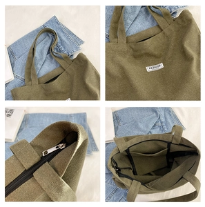 Detailed views of a green canvas tote bag featuring a zipper closure and fashion labels