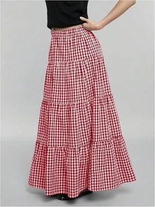 High-waist red plaid maxi skirt with a tiered A-line silhouette and vintage umbrella hem