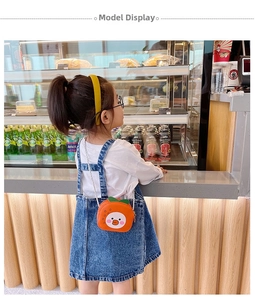 Cute orange cartoon duck mini shoulder bag for little girls shown on model in real life