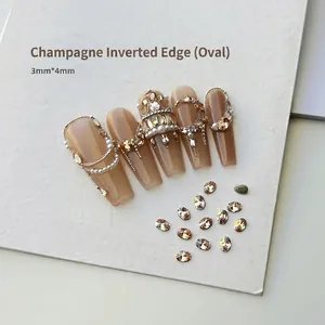 Close-up of 3x4mm champagne oval nail rhinestones applied on almond press-on nails