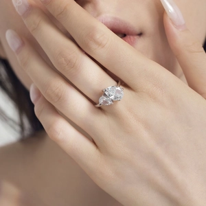 Close-up of S925 silver ring featuring two pear-cut ice flower sparkling stones
