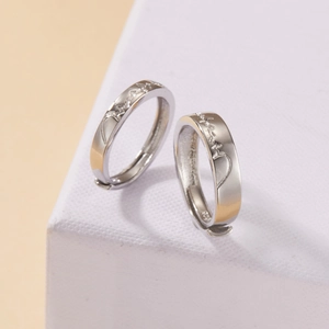 Macro detail of S925 sterling silver hoop earrings with heartbeat engraving and hallmark