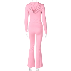 Rear view of pink two-piece tracksuit set with cropped hoodie and flared leggings