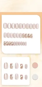 Detailed view of nude cat-eye press-on nails with champagne glitter and diamond accents