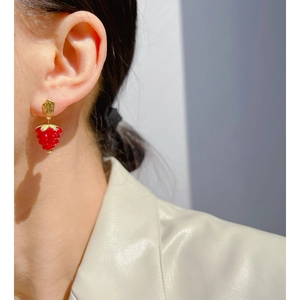 Sweet red raspberry glass earrings with gold finish, shown worn for a fresh summer look