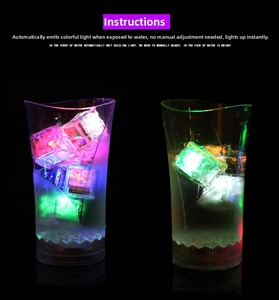 Detail of LED ice cubes glowing in liquid inside glasses with water sensor technology