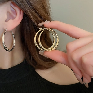 Textured geometric metal hoop earrings for women in gold and silver finish