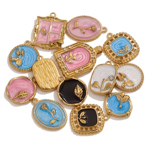 Assorted vintage oil-dripped gold pendants with colorful enamel and rhinestone details
