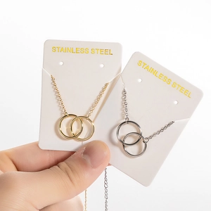 Interlocking double ring pendant necklace in gold and silver finish, stainless steel chain