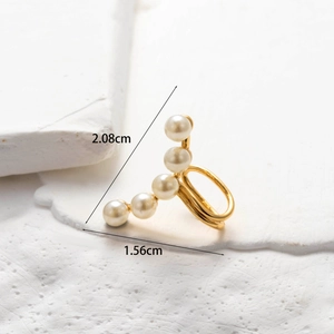 Detailed view of a gold-plated butterfly cartilage ear clip with white pearls and dimensions