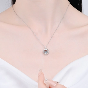 Elegant S925 sterling silver feather necklace with a dancing Moissanite pendant on a model