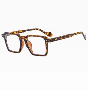 Detail view of square leopard print sunglasses with silver metal studs on frame