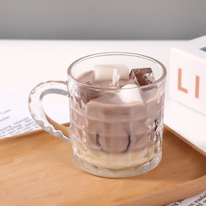 Vertical striped glass candle holder with coffee-colored scented wax and ice decor