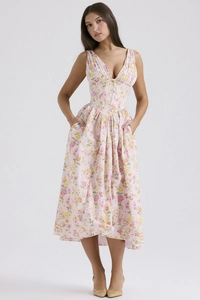 Detail of floral printed maxi dress with side pockets and smooth summer fabric texture