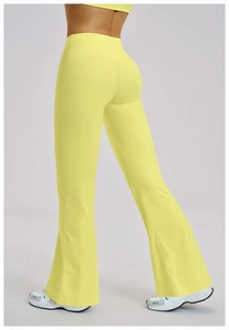 Rear view detail of high-waist lemon yellow flared yoga pants with slimming fit and matte texture