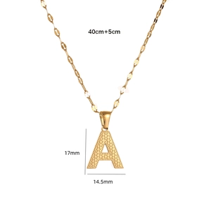 Detail shot of golden capital letter A pendant with textured dots and dimensions