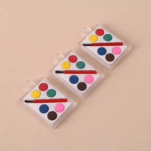 Miniature watercolor palette set with 6 vibrant colors and a small brush in clear case