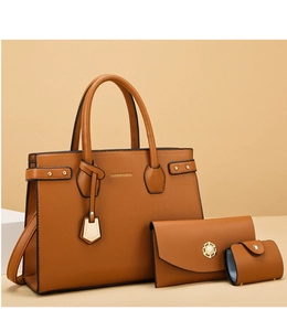 Detailed view of 3-piece brown pebbled leather tote bag set with gold hardware