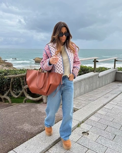 Detail of pink and white reversible quilted jacket with premium textured fabric finish