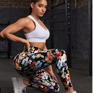 Women's white sports bra and colorful floral printed high waist yoga leggings set