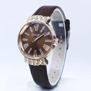 Detail view of coffee leather strap and rose gold watch case with Roman dial
