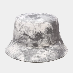 Close-up of black and white tie-dye bucket hat fabric texture with artistic dye patterns