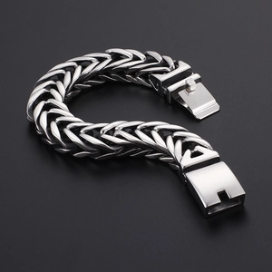 Close-up of a silver stainless steel woven V-shaped double layer bracelet for men