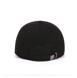 Rear view of black wool baseball cap featuring adjustable strap and gunmetal buckle