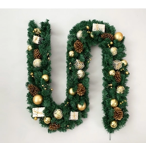 Detailed Christmas garland with pine cones, golden baubles and white gift boxes