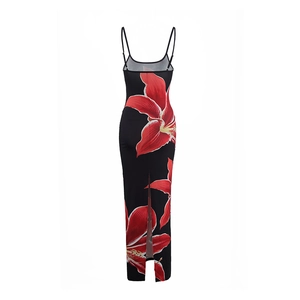 Detail of floral print maxi dress featuring thin straps and back slit on black fabric