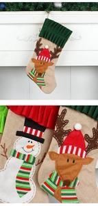 Close-up of burlap Christmas stocking featuring 3D felt reindeer and snowman embroidery