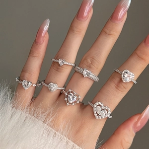 S925 sterling silver heart-shaped rings with sparkling zircon stones worn on fingers