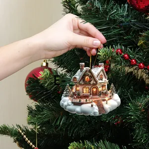 Close-up of hand hanging a lit dream cloud house ornament on a decorated Christmas tree