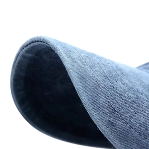 Macro view of navy blue washed baseball cap brim with high-quality textured stitching
