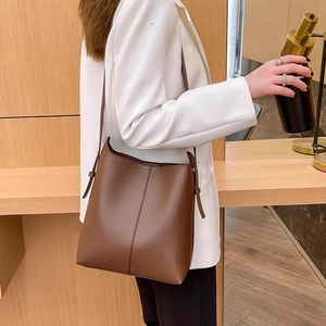 Minimalist brown leather bucket bag for women, stylish large capacity shoulder handbag