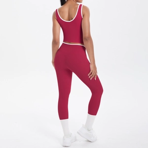 Rear view of two-piece red and white yoga set with hollow back top and high waist leggings