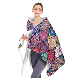 Detail of bohemian mandala microfiber beach towel with soft white fleece lining