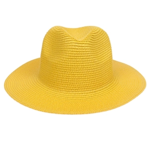 Detailed close-up of bright yellow straw fedora hat featuring tight weaving texture