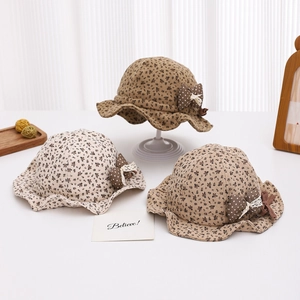 Floral baby bucket hats with polka dot bows in beige, khaki, and brown floral patterns