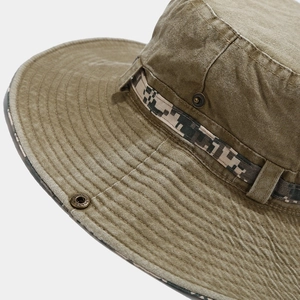 Detail of washed canvas bucket hat with vintage metal eyelets and camo trim strap