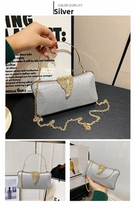 Detailed view of silver sequin evening clutch with golden leaf clasp and metal handle