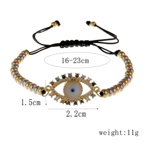Detail of evil eye charm bracelet with colored zircons and adjustable cord length