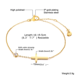 Detailed view of golden stainless steel cross bracelet with AAA cubic zirconia stone