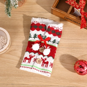 Knitted Christmas wine bottle cover with elk pattern, fur trim, and wooden buttons