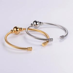 Adjustable stainless steel cable twist bangle bracelets in gold and silver finishes