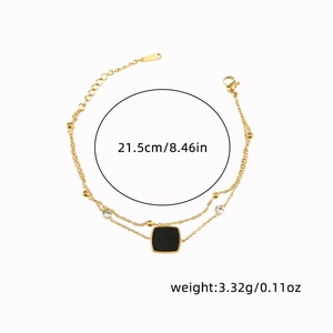 Double-layered titanium steel bracelet with black pendant and white crystal detail